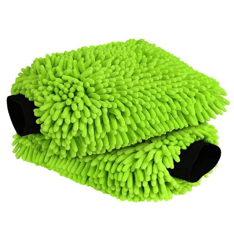 Hand wearing green chenille car wash mitt soaping up vehicle
